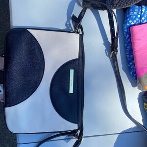 Anne Klein purse minor defect on back of purse. Never used. Black and white.